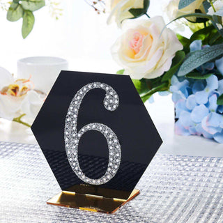 Elegant hexagon table number 6 with rhinestones on a shiny black base.
