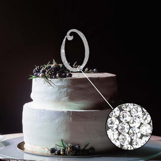 Sparkling cake topper with elegant design on a decorated cake. #whtbkgd