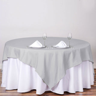 Add Elegance to Your Event with the Silver Square Seamless Polyester Table Overlay