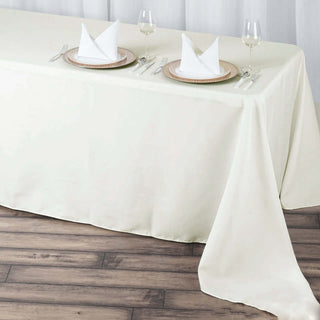 Elevate Your Event with the 90x156 Ivory Seamless Premium Polyester Rectangular Tablecloth Elevate Your Event with the 90x156 Ivory Seamless Premium Polyester Rectangular Tablecloth