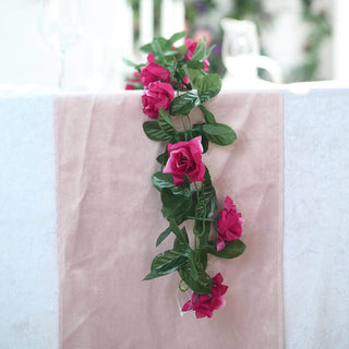 Artificial pink rose garland for decoration on table