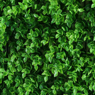Lush green artificial foliage background for home decor.