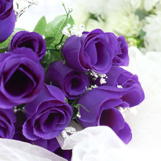 Purple artificial rose bouquet with delicate greenery and white accents.