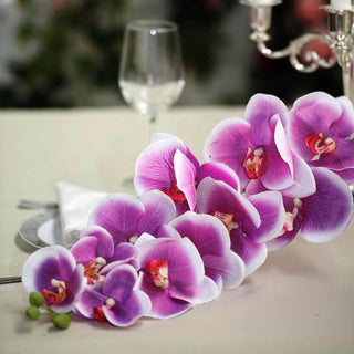 Purple orchid flower arrangement for elegant table decor.