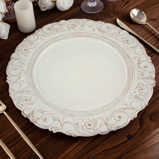 Elegant white decorative charger plate with intricate gold detailing.