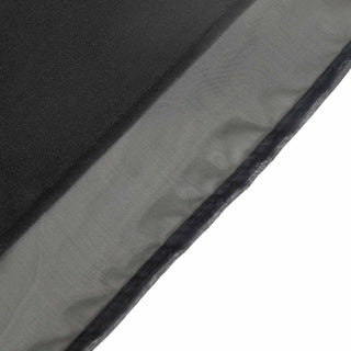 Close-up of a textured fabric in gray and black tones.