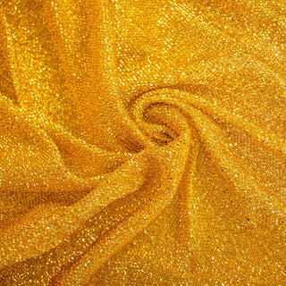 Shimmering gold fabric with a textured surface.