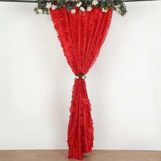 Red ruffled curtain with floral accents hanging elegantly.