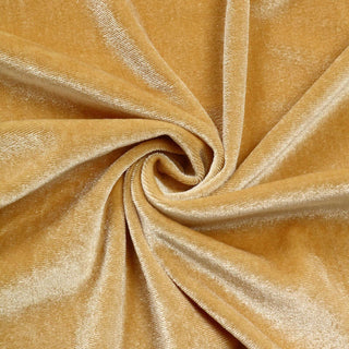 Luxurious golden velvet fabric swirl with soft sheen.