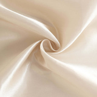 Silky cream fabric with a smooth texture and subtle sheen.