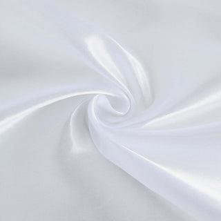 White satin fabric swirl with a smooth, shiny texture.