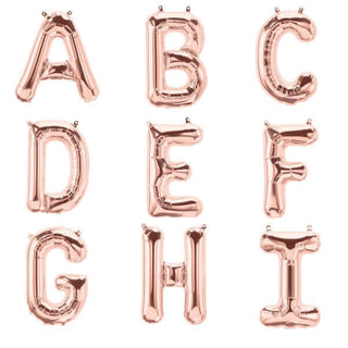 Rose gold balloon letters A to I on a white background