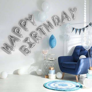 Decorative 'Happy Birthday' balloons in a festive living room setting.