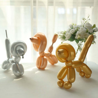 Colorful balloon animal sculptures in a bright, airy setting.