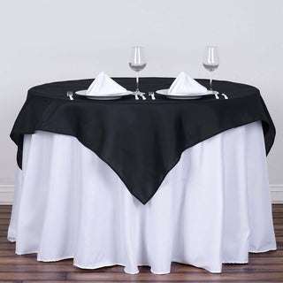 Elevate Your Event with the 54"x54" Black Square Polyester Table Overlay Elevate Your Event with the 54"x54" Black Square Polyester Table Overlay