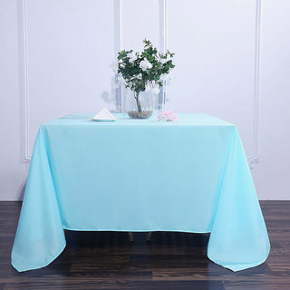 Enhance Your Dining Experience with the 90"x90" Blue Seamless Square Polyester Tablecloth