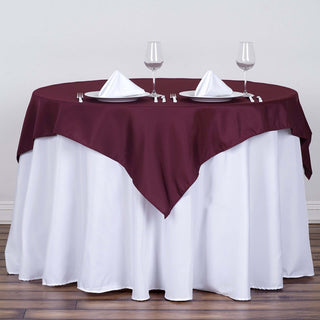 Add Elegance to Your Event with the Burgundy Square Polyester Table Overlay Add Elegance to Your Event with the Burgundy Square Polyester Table Overlay