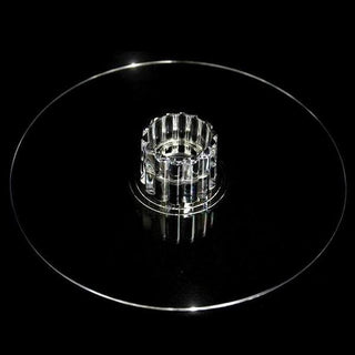 Clear glass cake stand with decorative base.