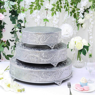 Tiered silver cake stand set with intricate designs, perfect for elegant displays.
