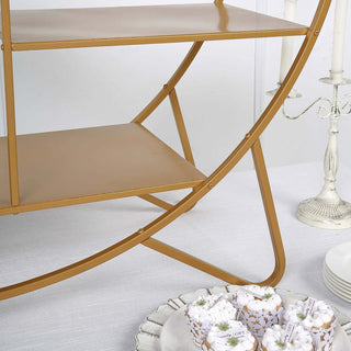 Gold metal cart with shelves, styled with decorative pastries and candles.