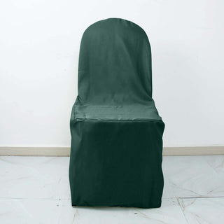 Green chair cover on a plain white backdrop.