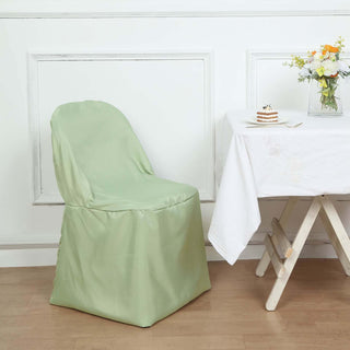 Green chair cover on a chair beside a table with flowers and dessert.