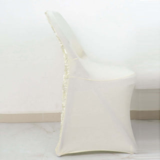 White chair cover with floral trim, side view.