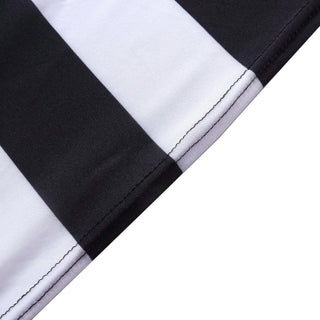 Black and white striped fabric close-up showing stitching details.