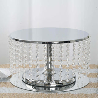 Mirrored round table with crystal bead accents on a white backdrop