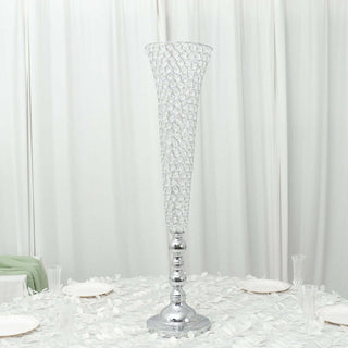 Elegant tall crystal vase with silver base, perfect for centerpieces.