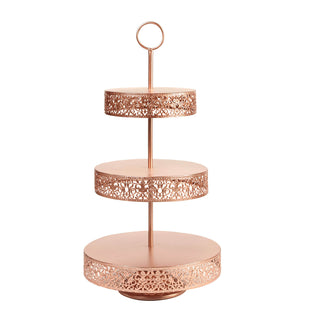 Three-tiered rose gold serving stand with intricate lace design. #whtbkgd