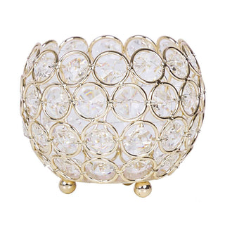 Gold and crystal decorative bowl with a circular design.