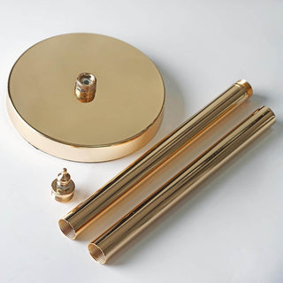 Gold plumbing fixture components on a white background.
