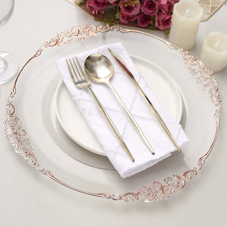 Elegant table setting with silver utensils and decorative plate.