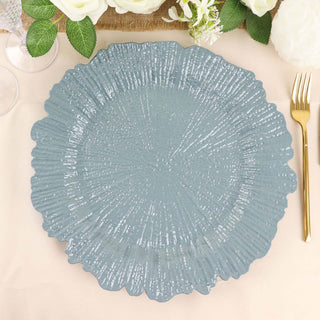 Textured blue decorative plate on a table setting.