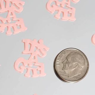 Pink "DA GATE" letters scattered with a quarter for scale.
