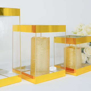 Gold and transparent candle holders with a textured candle inside