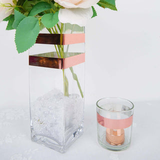 Glass vase with decorative stripes and a matching candle holder.
