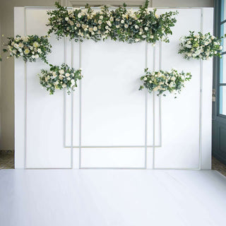 Floral arrangement on a white backdrop for events or photography.