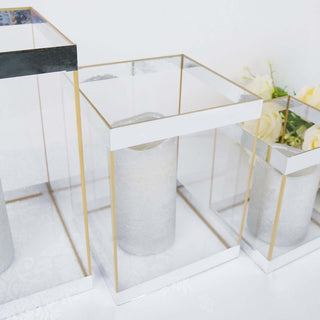 Elegant glass candle holders with gold accents on a white background.