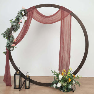 Decorative wedding backdrop with floral accents and lanterns.