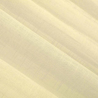 Textured yellow fabric draping with soft folds and subtle sheen.