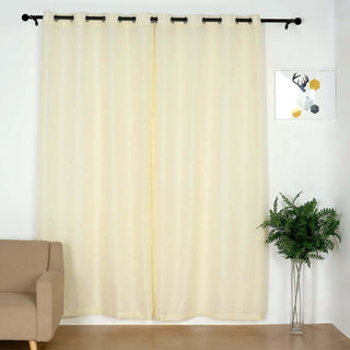 Light yellow sheer curtains hanging from a rod in a cozy living room setting.