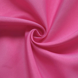 Pink fabric texture in a spiral pattern.