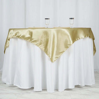 Enhance Your Event Decor with the 60"x60" Champagne Square Smooth Satin Table Overlay Enhance Your Event Decor with the 60"x60" Champagne Square Smooth Satin Table Overlay