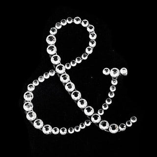 Rhinestone ampersand design on a black background.