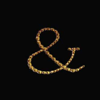 Golden ampersand symbol on a dark background.
