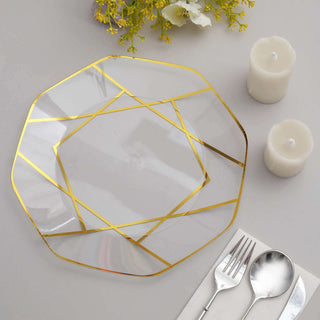 Elegant glass plate with gold geometric design on a table setting.