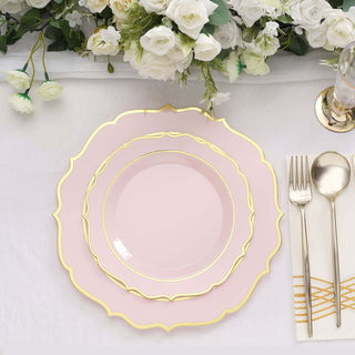 Elegant pink dinner plates with gold trim arranged on a table setting.