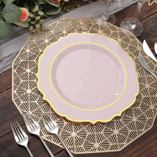 Elegant pink plate with gold trim on a textured gold placemat.